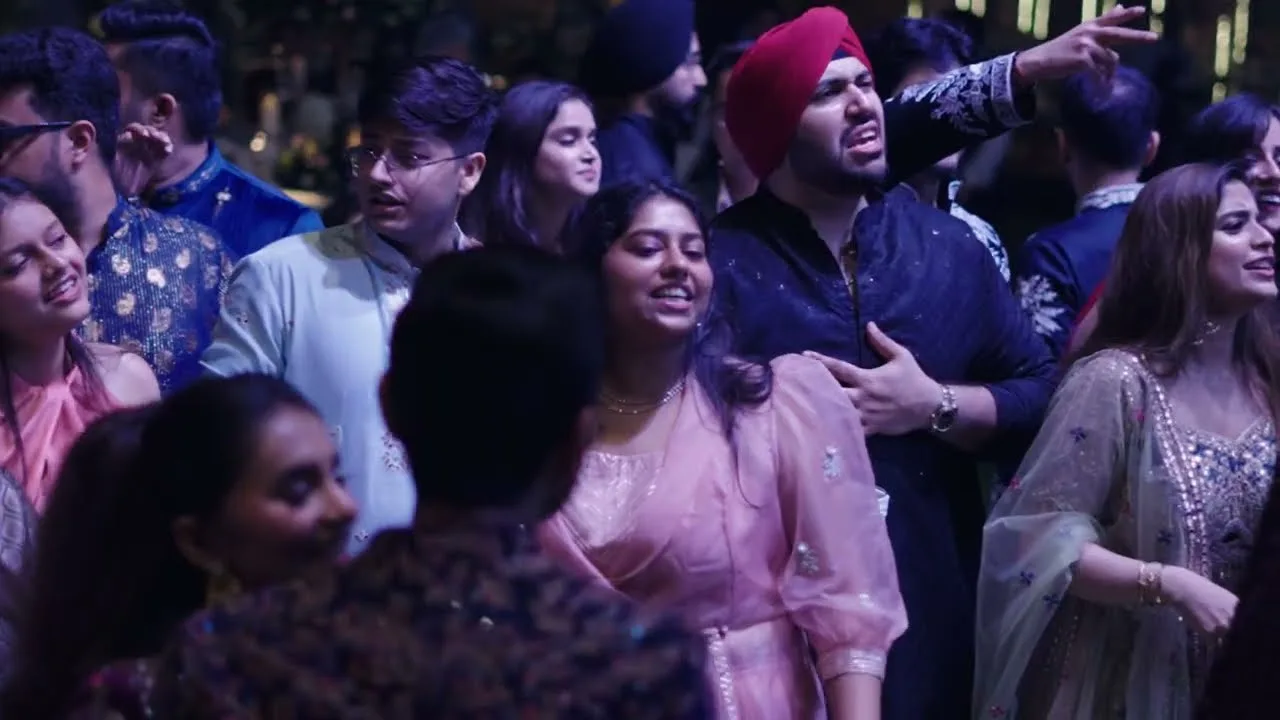 A packed, joyful crowd singing along at a Bairagi Live show.