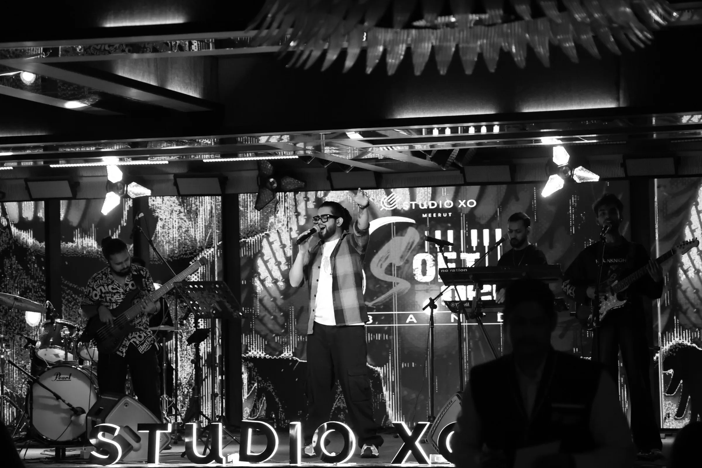 Black-and-white shot of Softrock performing on the Studio XO club stage.